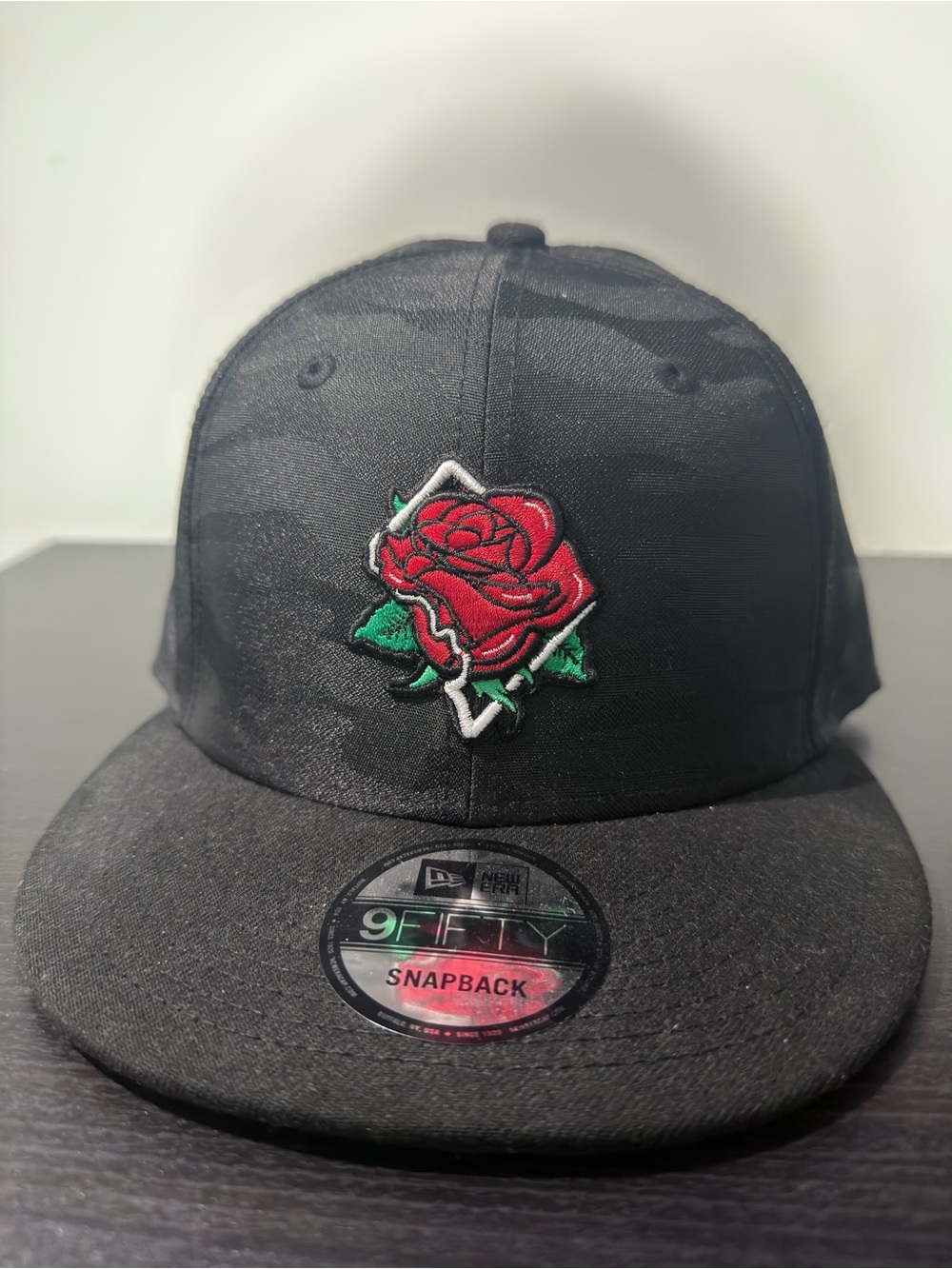 New Era DC Men's Black Snapback Hat with Red Rose Patch